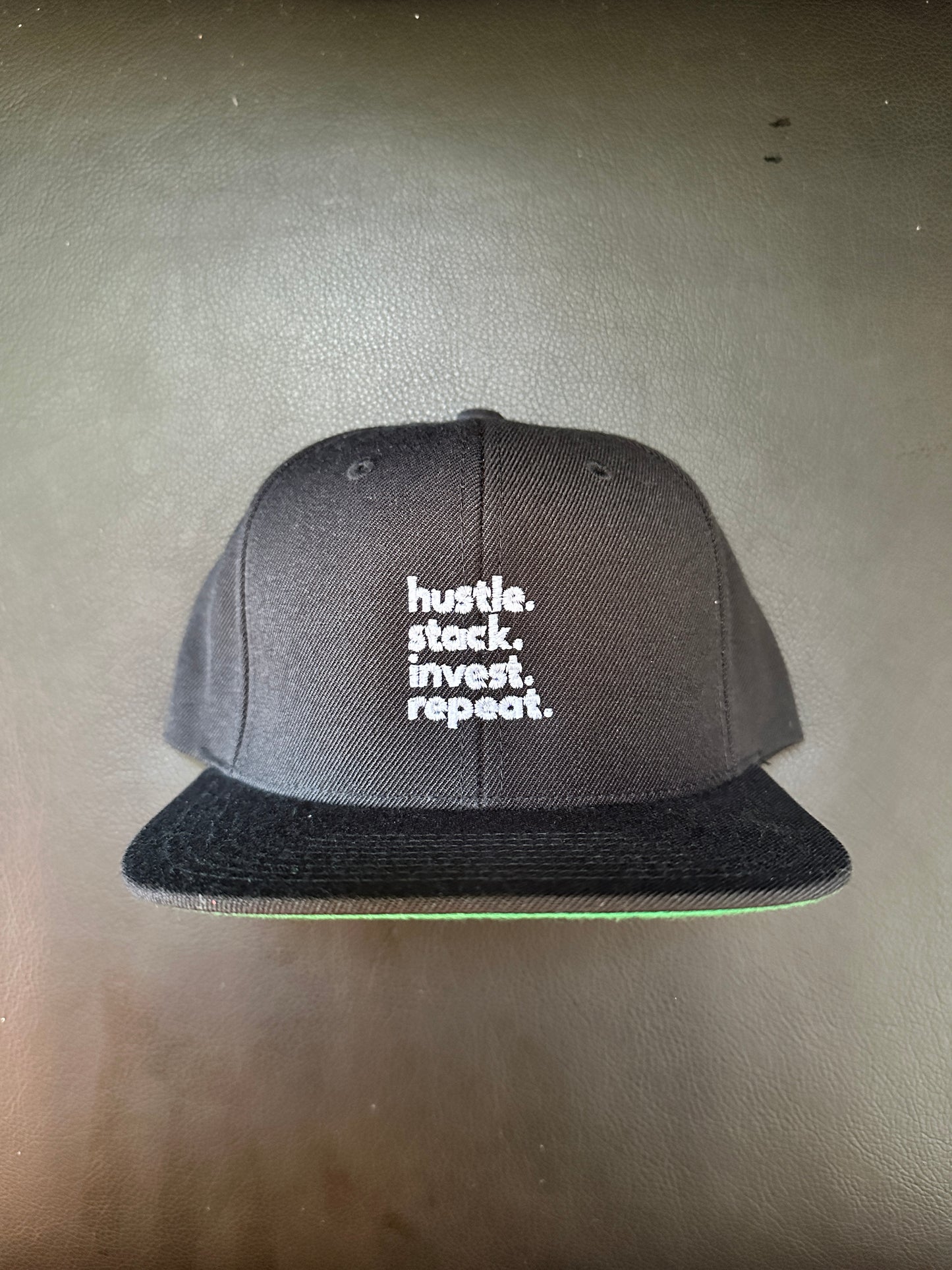 hustle. stack. invest. repeat. SnapBack Cap